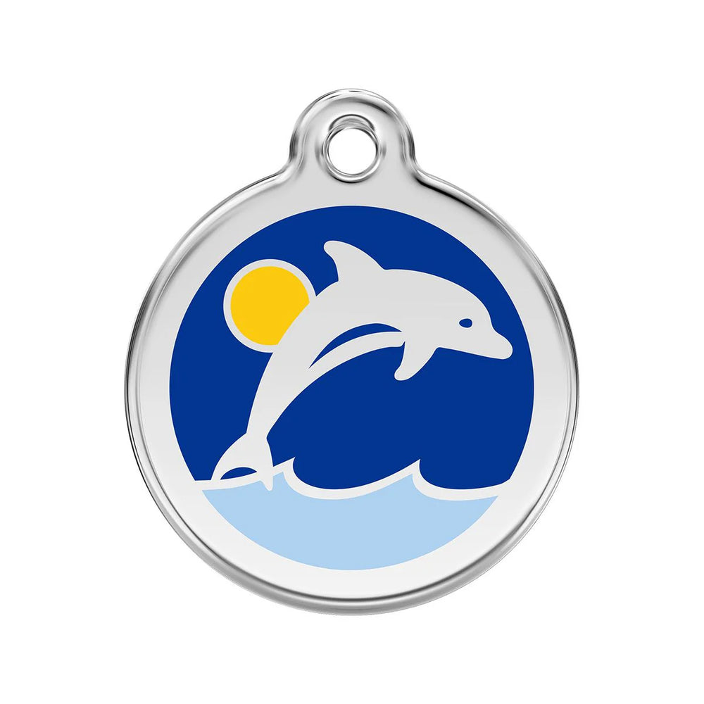Round pendant with dolphin design on a blue background