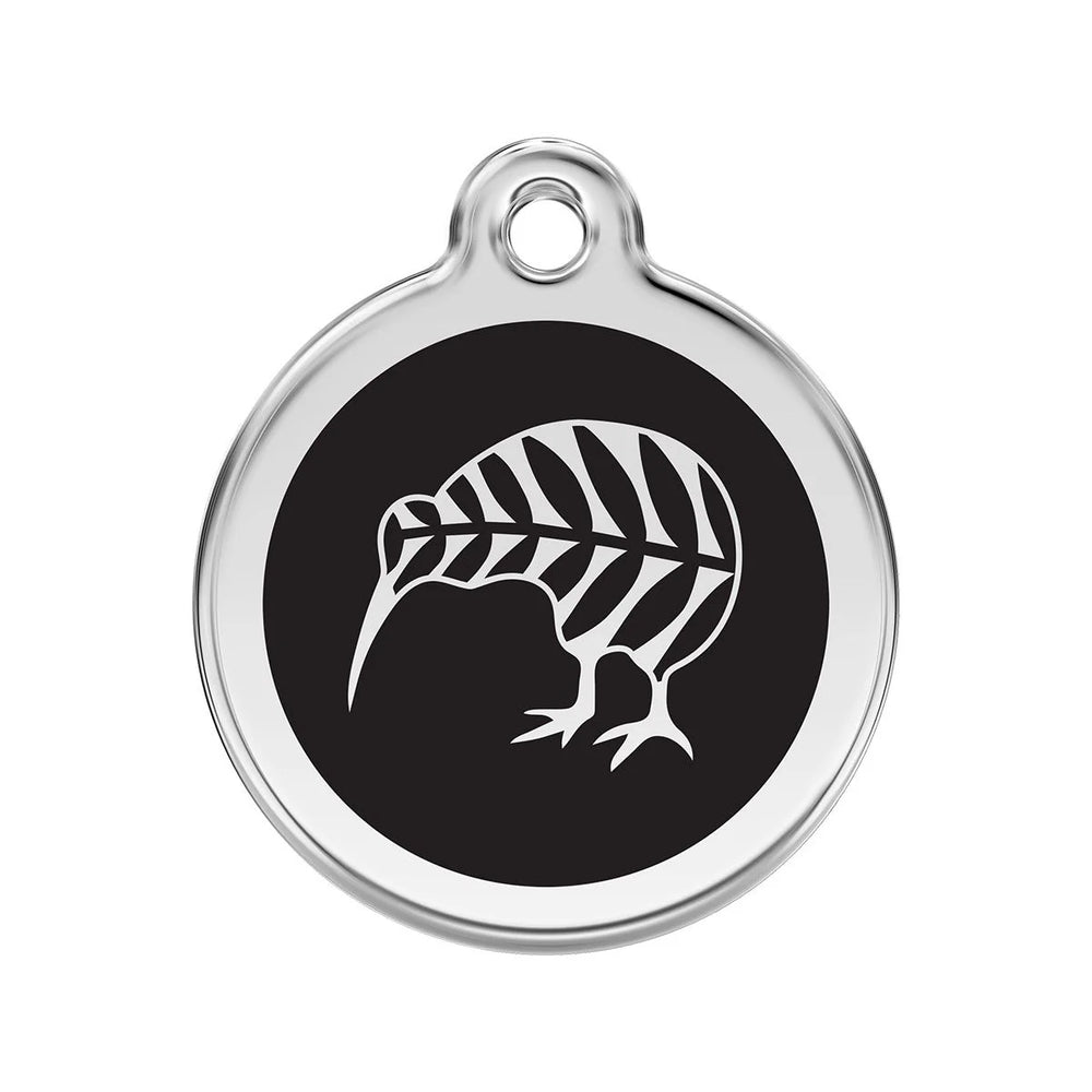 Round metallic tag with black center and white leaf design on a white background
