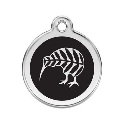 Round metallic tag with black center and white leaf design on a white background