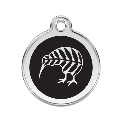 Round metallic tag with black center and white leaf design on a white background