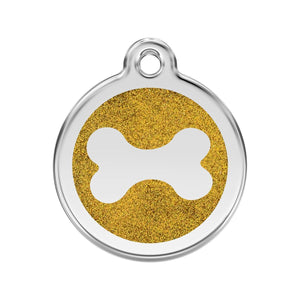Dog tag with gold glittery bone design on a white background