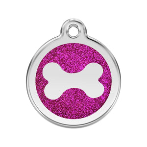 Round pet tag with pink glittery background and white bone design on a white background