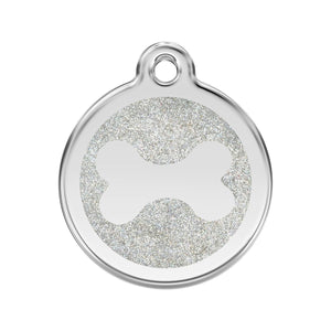 Silver pendant with a circular design on a white background