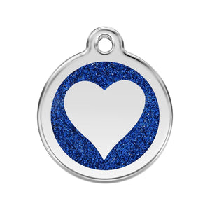 Heart-shaped pendant with blue glitter border and white center on a white background