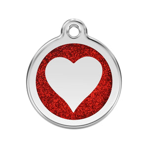 Pet tag with red glitter heart and white center on a white background