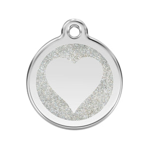 Silver pet tag with a heart design on a white background