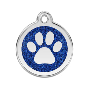 Pet tag with blue glittery background and white paw print on a white background