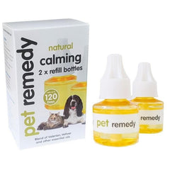 Pet remedy natural calming essential oil refill bottles and packaging box, featuring two amber glass bottles with white dropper caps and a white box with images of a dog and cat.