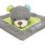Plush toy mouse on a gray blanket with green polka dot border