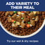 Dog food bowl with dry kibble and wet pet food on a blue background with text promoting variety in meals.