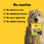 Dog holding a package of 'Animals Like Us' dog treats with a yellow background and text about ingredient claims.