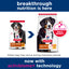 Two packages of Hill's Science Diet Large Breed dog food with a blue banner and text about breakthrough nutrition and Activbiome technology.