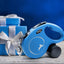 Blue retractable dog leash with a gift box in the background