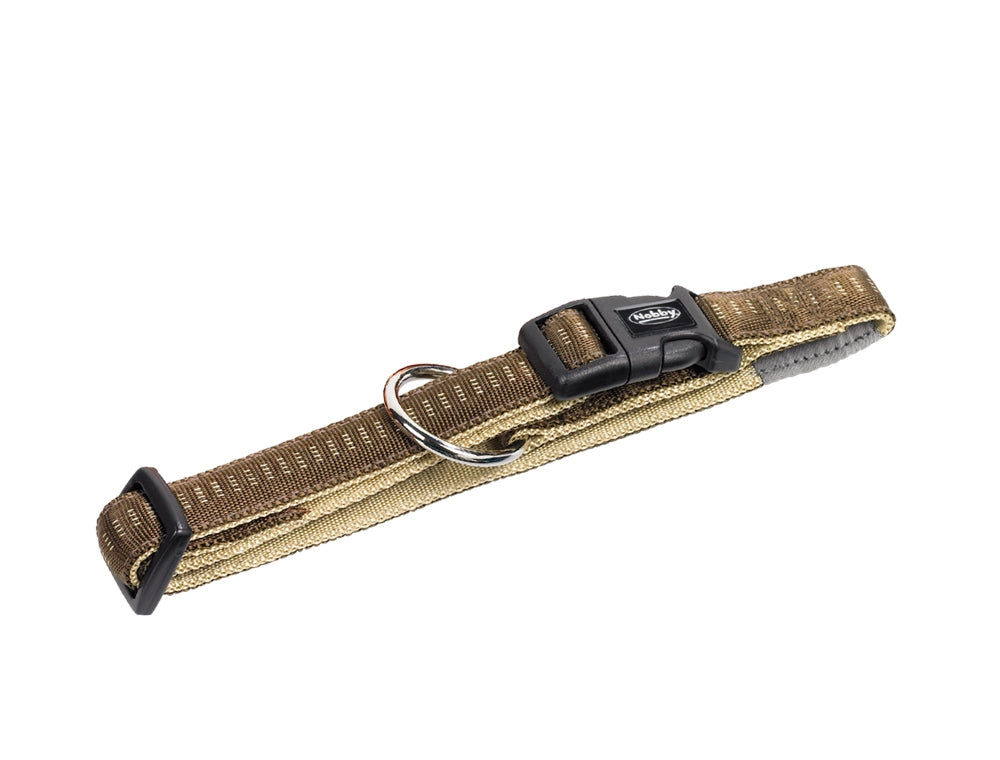 Brown dog collar with black buckle on a white background