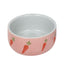 Ceramic bowl with pink base and white interior on a white background