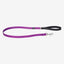 Purple dog leash with a black handle on a white background