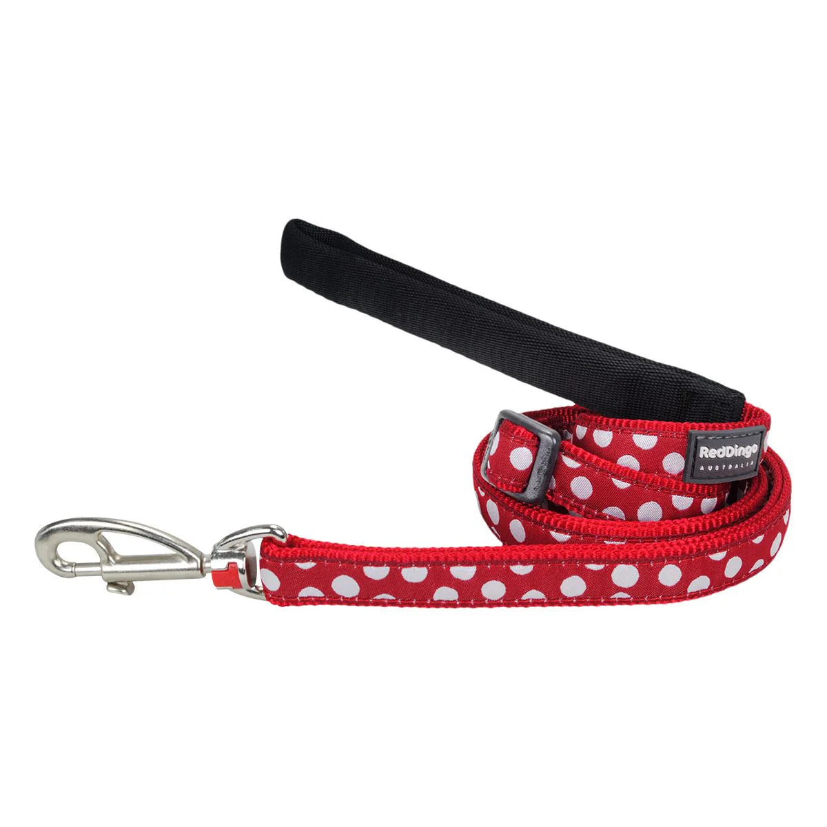 Red dog leash with white polka dots and black handle on a white background