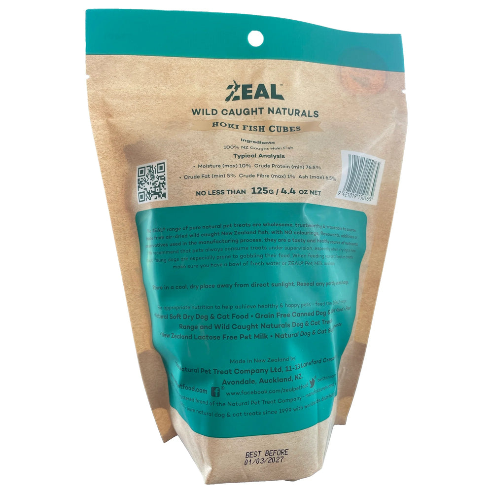 A bag of Zeal Free Range Naturals Hoki Fish Cubes air dried pet treats, shown with several cubes piled in front on a white background.
