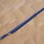 Blue dog leash on a sandy background