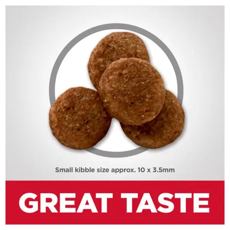 Dog food kibble with 'GREAT TASTE' text on a white background
