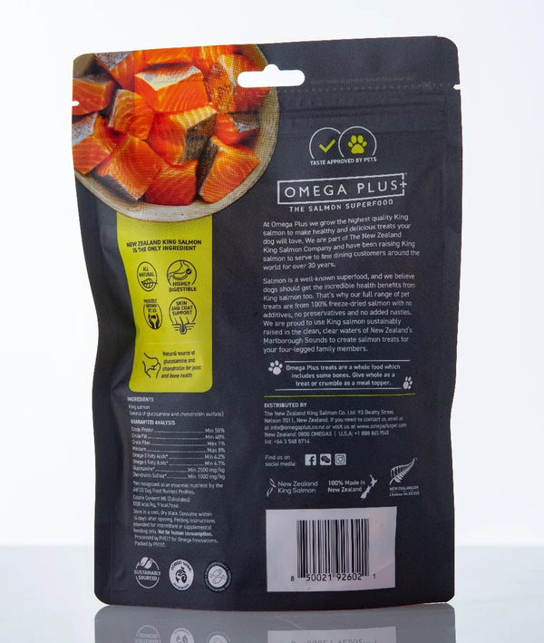 Back view of a black pet food packaging with salmon chunks and branding details.