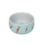 Ceramic bowl with carrot design on a light blue background