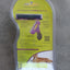 Cat grooming tool in packaging on a concrete floor