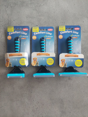 Three packages of Rubis comfort line dog toys on a concrete floor.