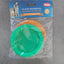 Green silicone lid and packaging on a gray surface