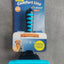 Dog grooming brush with packaging on a concrete surface