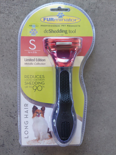 Pet grooming tool with packaging on a concrete surface